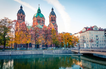 Spectacular autumn view of Landmark Protestant St. Luke's Church. Bright morning cityscape of Munich, Bavaria, Germany, Europe. Traveling concept background.