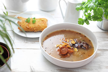 Mushroom soup with forest, vegetarian sausage served with krolietem stuffed cabbage, oyster mushrooms.