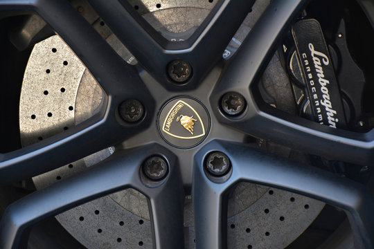 PRAGUE, CZECH REPUBLIC - JUNE 09, 2017: Close up of the wheel rim of luxury Lamborghini car and the gold logo.