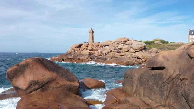 Aerial view of the Pink Granite Coast in northern Brittany on the municipality of Perros-Guirec, France, with the Ploumanach lighthouse,