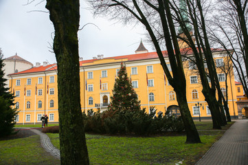 RIGA, LATVIA - DECEMBER 5, 2018: Riga castle with a park on the grey day. Sightseeing tourist...