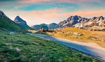 Colorful autumn sunrise on Sedlo pass. Picturesque morning view of Durmitor National Prk, Montenegro, Europe. Beautiful world of Mediterranean countries. Traveling concept background.