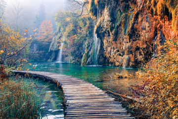 Amazing morning view of pure water waterfall in Plitvice National Park. Marvelous autumn scene of Croatia, Europe. Beauty of nature concept background.