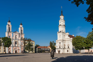 Fototapeta na wymiar Kaunas - Jesuit church of St. Francis Xavier and the White Swan Town Hall in the center of Kaunas in Lithuania