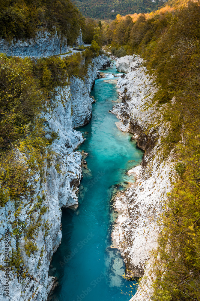 Wall mural turquoise soca river flows in rocky canion in slovenia - Wall murals