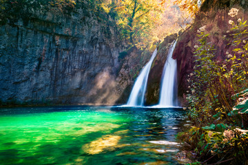 Fototapeta na wymiar Perfect morning view of pure water waterfall in Plitvice National Park. Stunning autumn scene of Croatia, Europe. Abandoned places of Plitvice lakes series. Beauty of nature concept background.