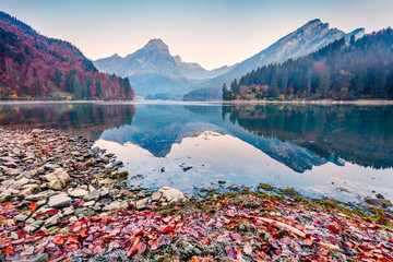 Splendid autumn sunrise on Obersee lake, Nafels village location. Misty morning scene of Swiss...