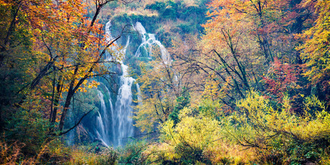 Panoramic morning view of pure water waterfall in Plitvice National Park. Amazing autumn scene of Croatia, Europe. Abandoned places of Plitvice lakes series. Beauty of nature concept background.