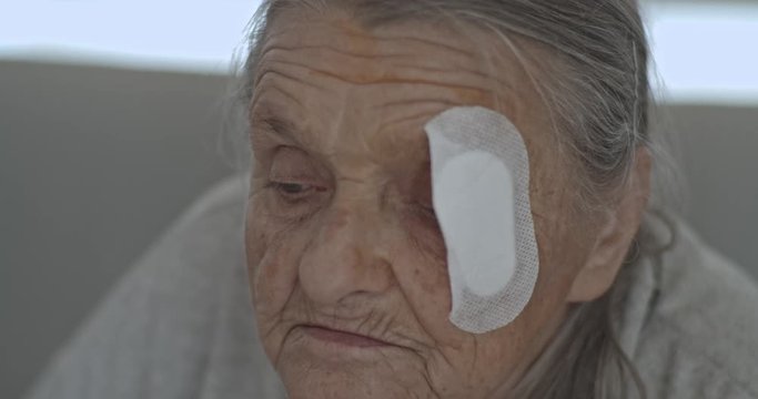 Old Lady with injured eye Cataract, Glaucoma close up