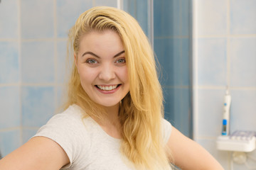 Woman with wet blonde hair