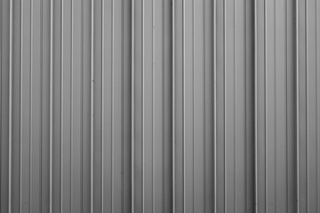 Front view of gray ribbed metal surface on fence or wall for backdrop