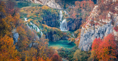 Panoramic morning view of pure water waterfall in dyyp canyon. Awesome autumn scene of Plitvice National Park, Croatia, Europe. Beauty of nature concept background.