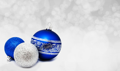 Christmas glowing grey background. Holiday New year abstract glitter defocused background for card. Blurred bokeh.