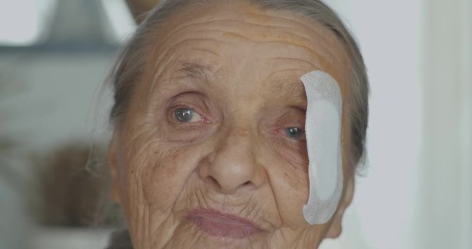 Old Lady with injured eye Cataract, Glaucoma close up