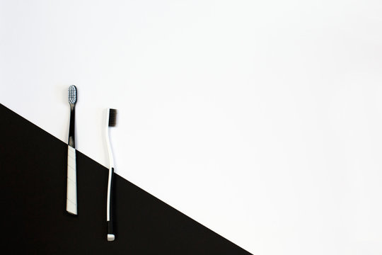 Manual toothbrush set on white and black background.