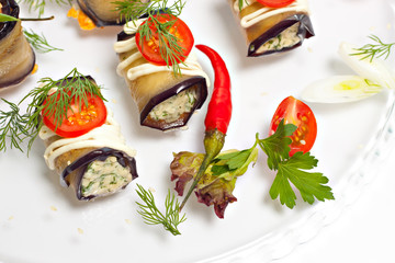 Fototapeta na wymiar Egg-plant rolls with cheese whith chilie closeup
