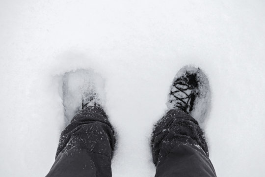 Male feet in deep snow