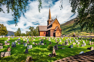 Picturesque summer view of Lom stave church (Lom Stavkyrkje). Sunny morning scene of Norwegian...