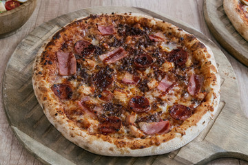 Homemade barbecue chicken pizza with onion and special sauce. Pizza with ingredients to cook it. Delicious Italian food