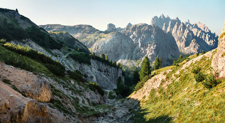 Rocky summer scene of National Park Tre Cime di Lavaredo with Cadini di Misurina range on background. Splendid morning view of Dolomiti Alps, Italy, Europe. Beauty of nature concept background.
