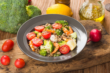 Buckwheat salad with broccoli chicken breast shrimp, Three-color quinoa salad. Superfood and healthy eating concept.