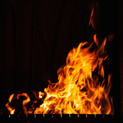 Fire. Strong burning of fire at night. Bonfire in the barbecue, fireplace and hearth.