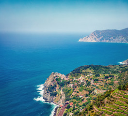Fototapeta na wymiar Third village of the Cique Terre sequence of hill cities - Corniglia. Colorful spring morning in Liguria, Italy, Europe. Picturesqie seascape of Mediterranean sea. Traveling concept background.