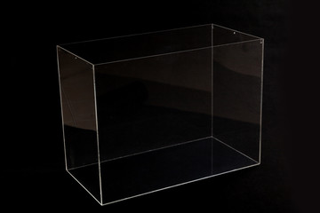 Glass transparent parallelepiped on black background