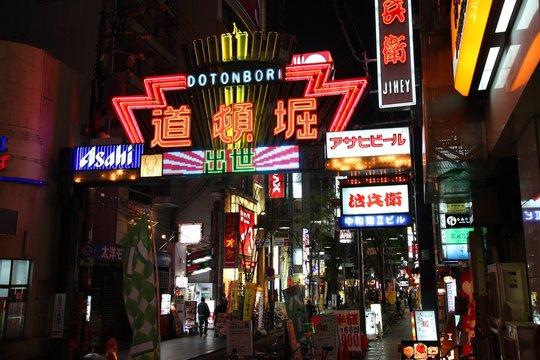 OSAKA, JAPAN - APRIL 25: People visit famous Dotonbori street on April 25, 2012 in Osaka, Japan. According to Tripadvisor Dotonbori is the 3rd best attraction to visit in Osaka.