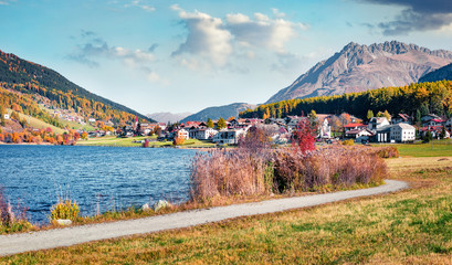 Sunny autumn view of Monteplair village, Resia lake location, Itay, Europe. Splendid morning scene of Italian Alps. Traveling concept background.