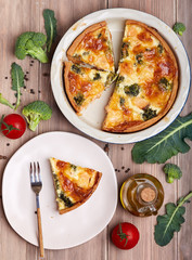 Quiche open tart pie with salmon fish, broccoli and cheese. Savory taste