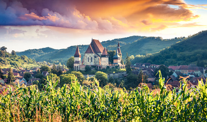 Picturesque summer view of Fortified Church of Biertan, UNESCO World Heritage Sites since 1993. Impressive morning cityscape of Biertan town, Transylvania, Romania, Europe. 