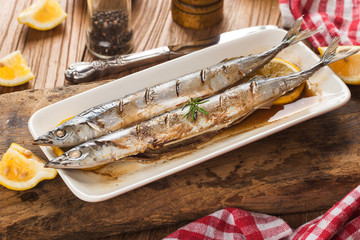 a plate of fresh barbecue saury