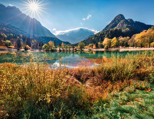 Perfect morning view of Jasna lake. Great autumn scene of Julian Alps, Gozd Martuljek location, Slovenia, Europe. Wonderful landscape of Triglav National Park. Traveling concept background.