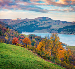 Colorful morning view of Roselend lake/Lac de Roselend. Stunnig autumn scene of Auvergne-Rhone-Alpes, France, Europe. Beauty of nature concept background.