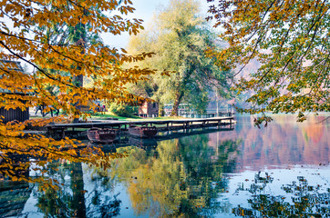 Attractive morning view of pure water lake with boats in Plitvice National Park. Captivating autumn...