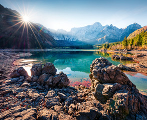 Picturesque autumn view of Fusine lake. Splendid morning scene of Julian Alps with Mangart peak on...