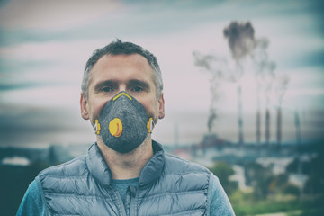 Man wearing a real anti-pollution, anti-smog and viruses face mask