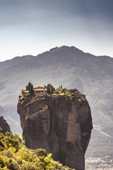 Meteora Monastery in Greece, built on rocks. Sunny day, blue sky.