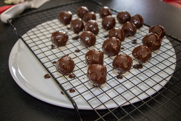 Fresh chocolate balls on kitchen counter 