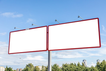 Two blank advertisement panels on the outskirts of city