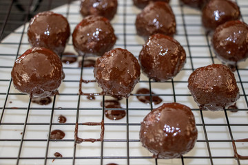 Delicious fresh chocolate balls in kitchen