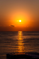 Summer sea sunset in Greece. Fisherman in boat.