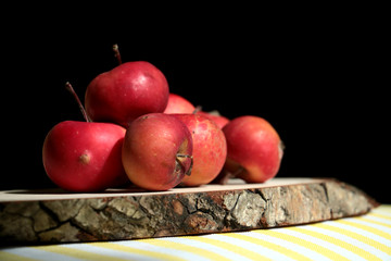 red small apples isolated on black background