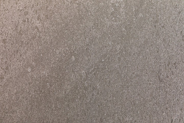 Gray granite natural stone ceramics close-up with abstract grite pattern for background