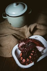 Octopus. Seafood in the restaurant. Octopus is prepared in the restaurant on the table.