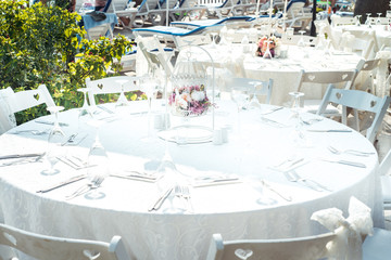 decorated for wedding elegant dinner table outdoors. Wedding at the sea in the summer. Oriental wedding