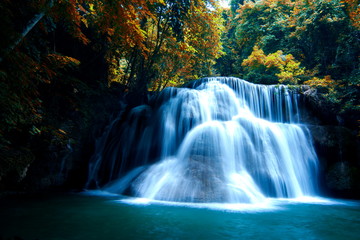 Fototapeta na wymiar Waterfall in the forest And colorful leaves, Famous tourist attractions of Thailand.