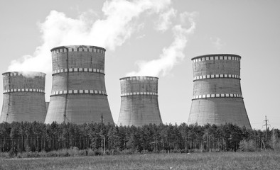 Atomic reactor. Operating nuclear power plant. Smoke from the chimney, black and white. Power...
