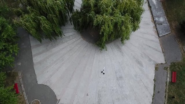 Aerial view of funny mime dancing outdoors